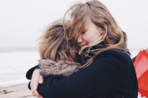 Mum hugging child